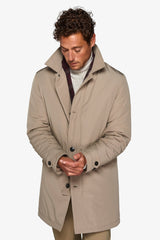 Beige quilted trench coat