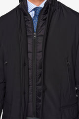Black technical coat with bib