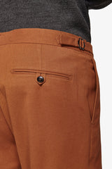 Suit trousers with pleats and biscuit straps