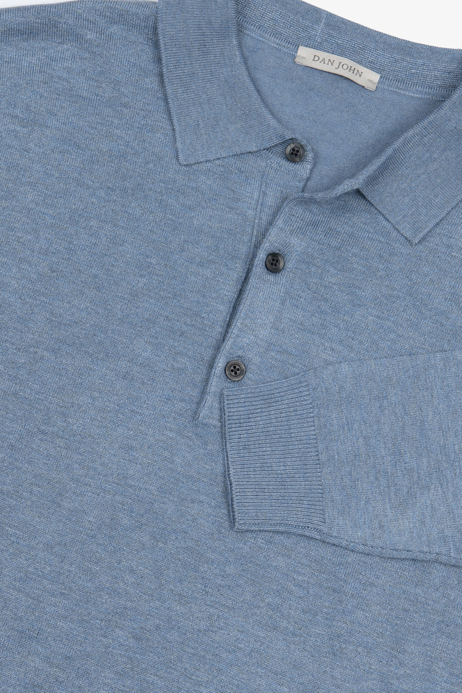 Knitted polo shirt with light blue buttons