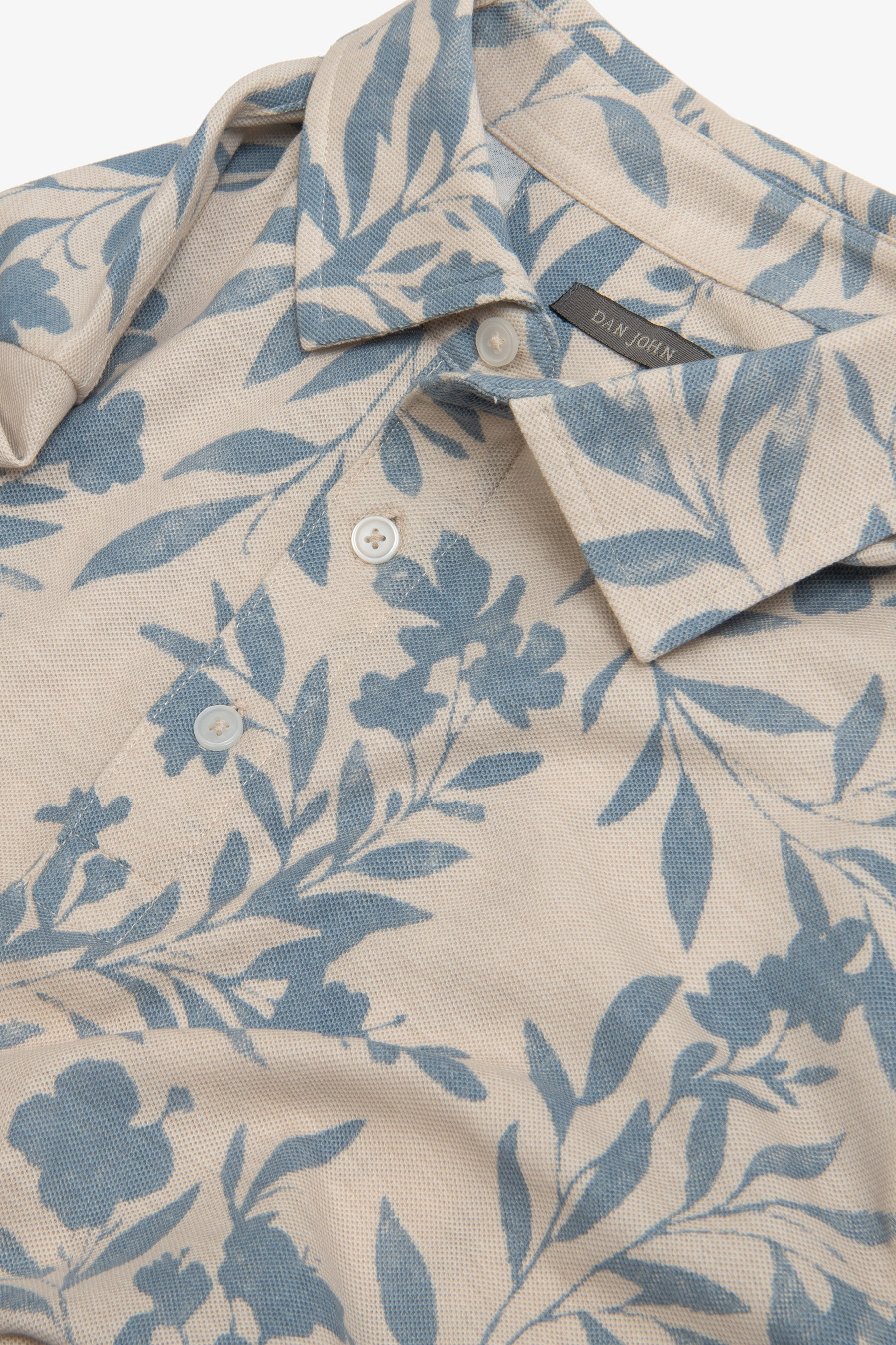 Polo in piquet fantasia fiore celeste-Dan John